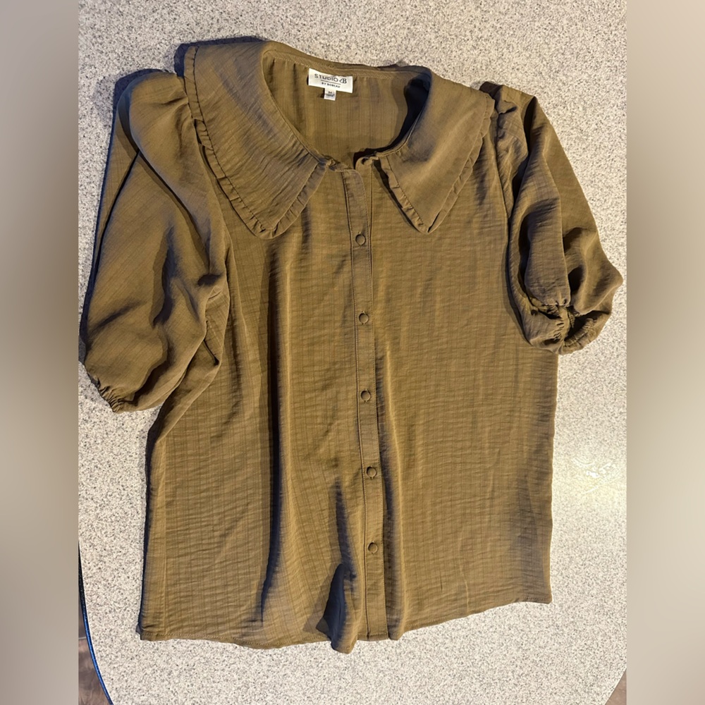 Dark tan blouse, loose puffy sleeves with elastic openings